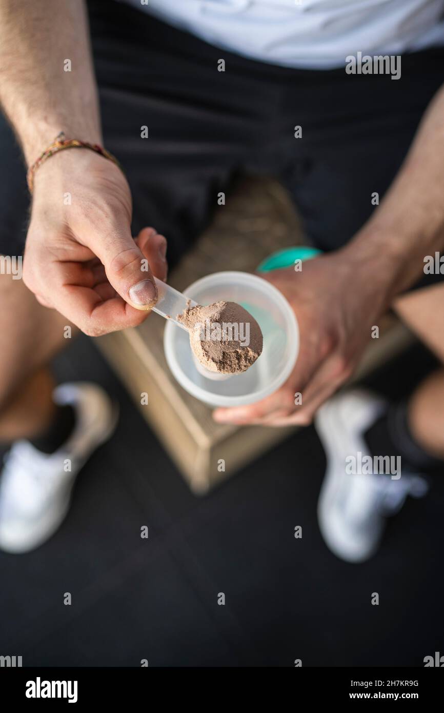 Male athlete making protein shake after working out Stock Photo Alamy