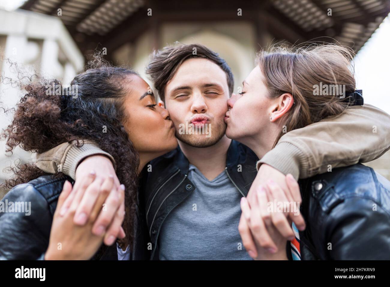 Kissing cheeks friends hi-res stock photography and images pic