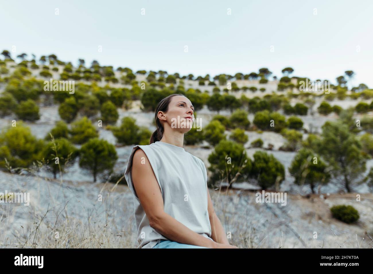 Woman contemplating while sitting at old mine Stock Photo