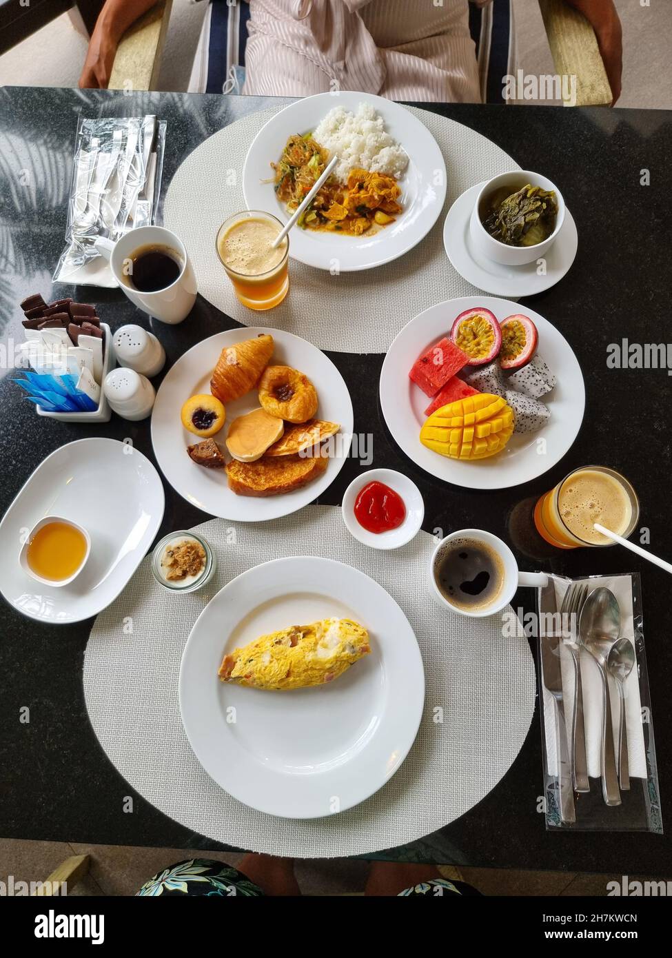 Luxury breakfast table with bread croissants and fruits and coffee