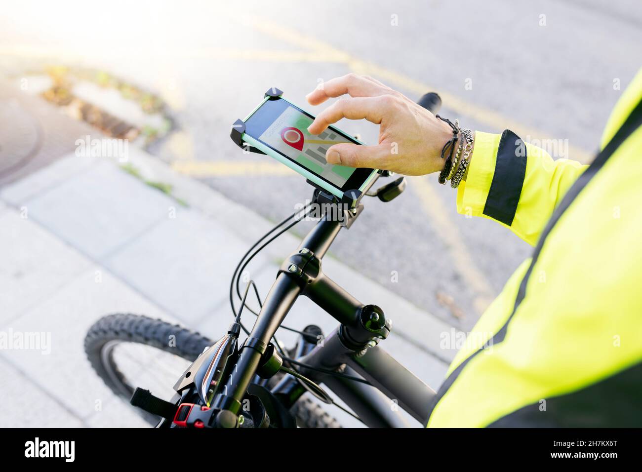 Delivery man using city map on bicycle Stock Photo