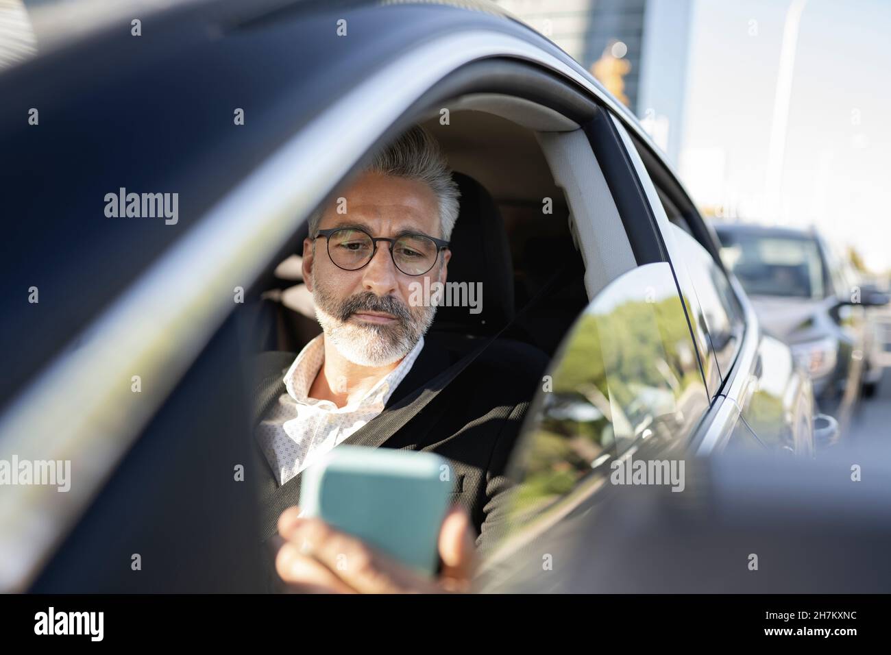 Serious man driving car in hi-res stock photography and images - Alamy
