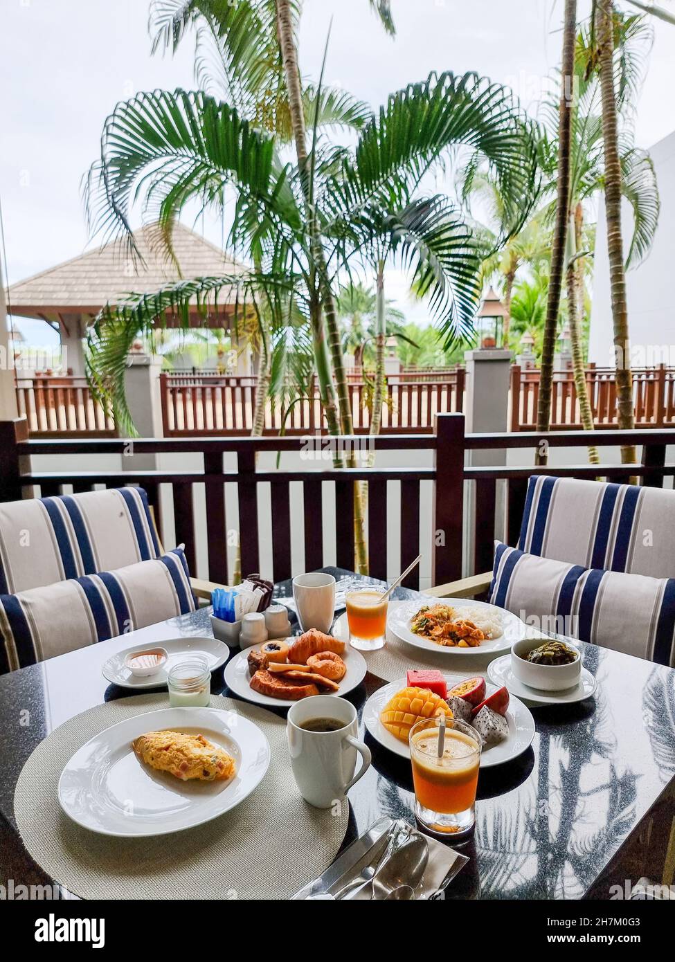 Luxury breakfast table with bread croissants and fruits and coffee