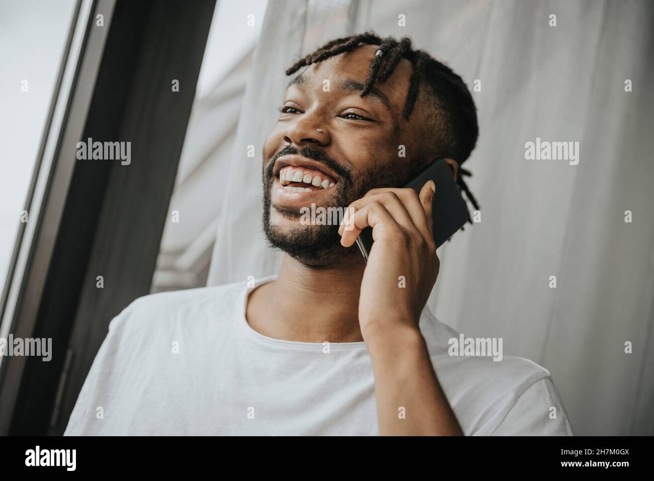 Bearded man talking on phone Stock Photo