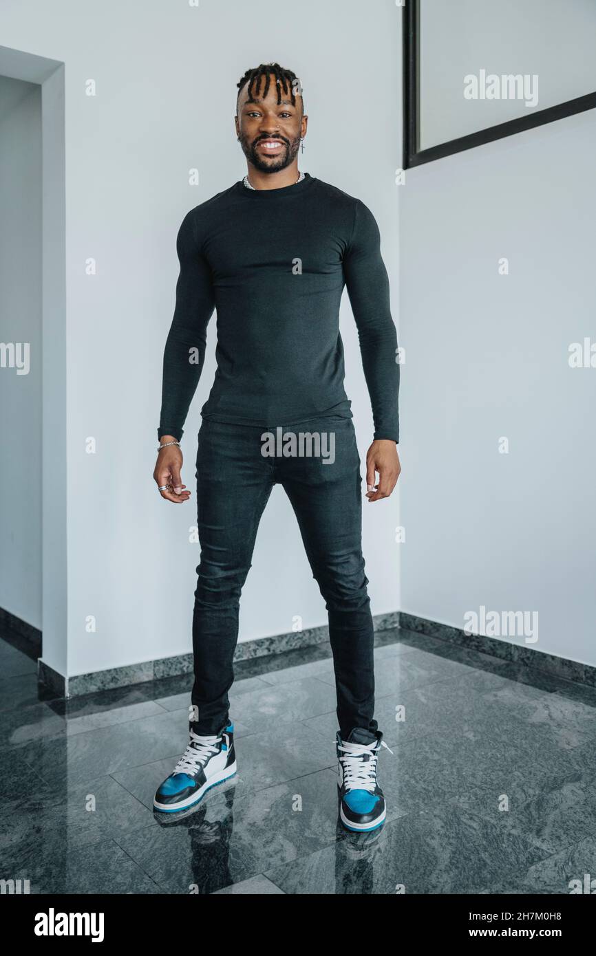 Young smiling man standing Stock Photo