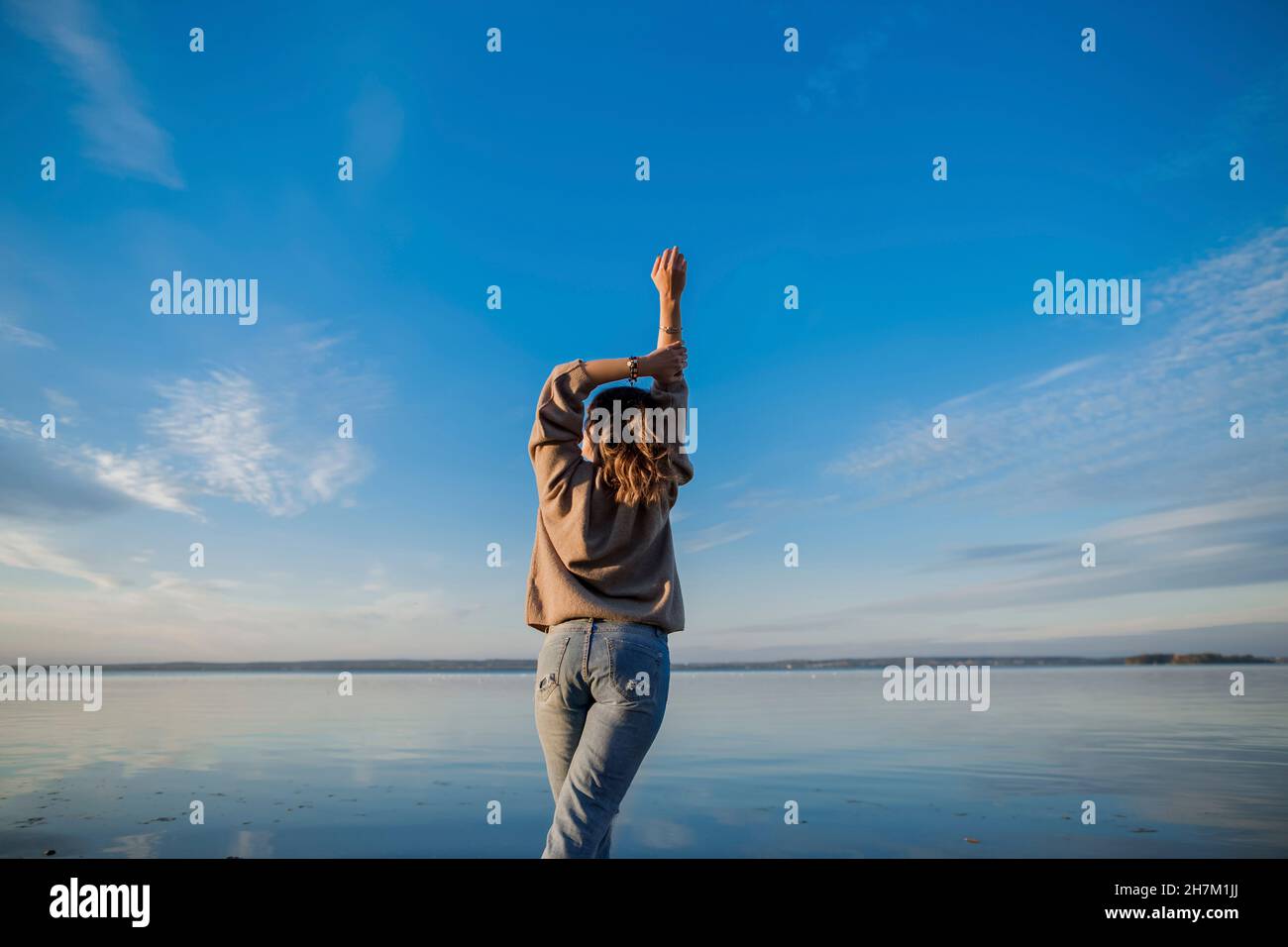 Woman raised hand rear hi-res stock photography and images - Alamy