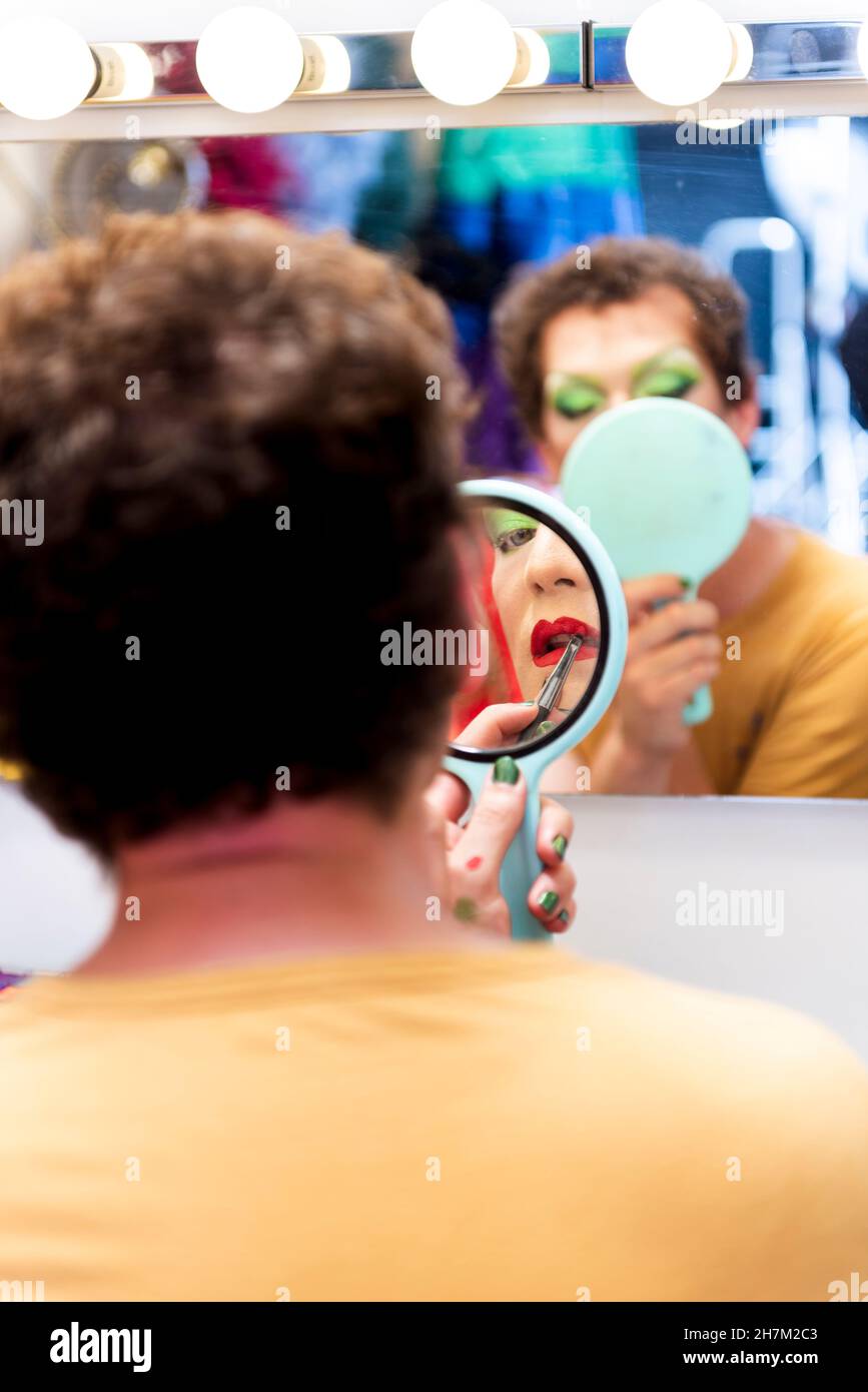 Men doing makeup in dressing room Stock Photo