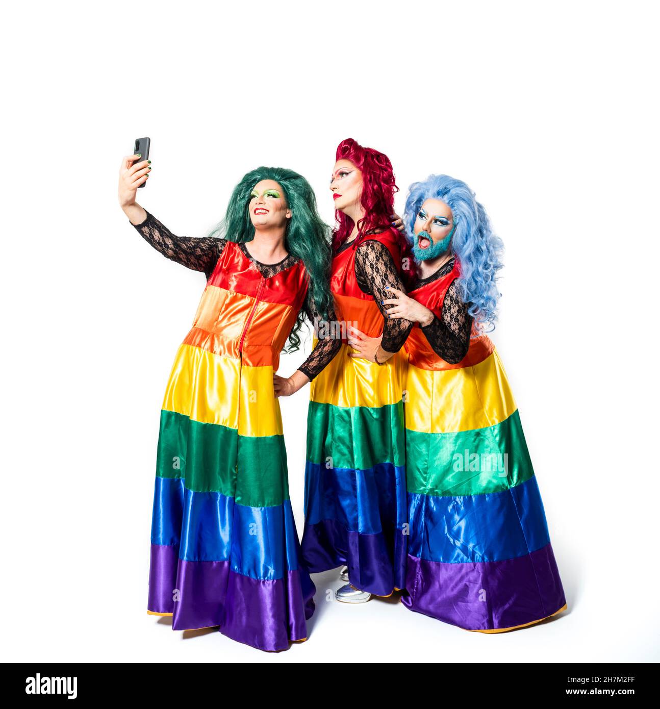 Drag queen with rainbow dress against background Stock Photo