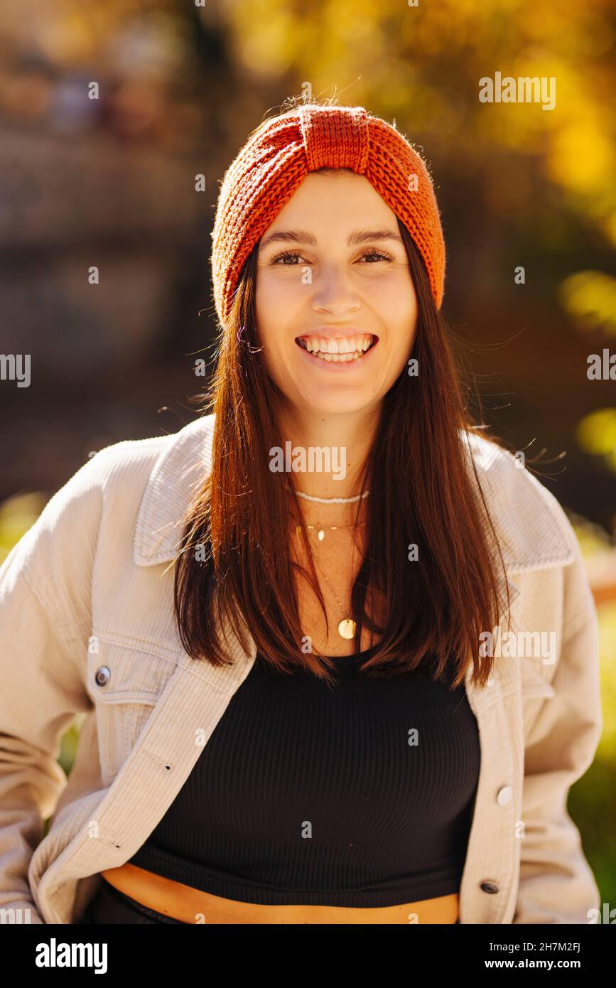 Happy young woman with knit hat and jacket Stock Photo