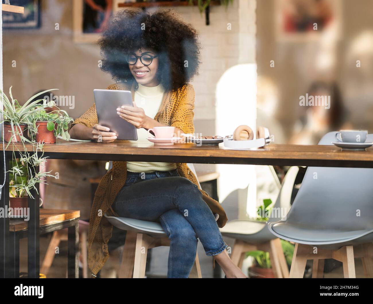 Woman M Using Hispanic african american woman using hi-res stock photography and ...