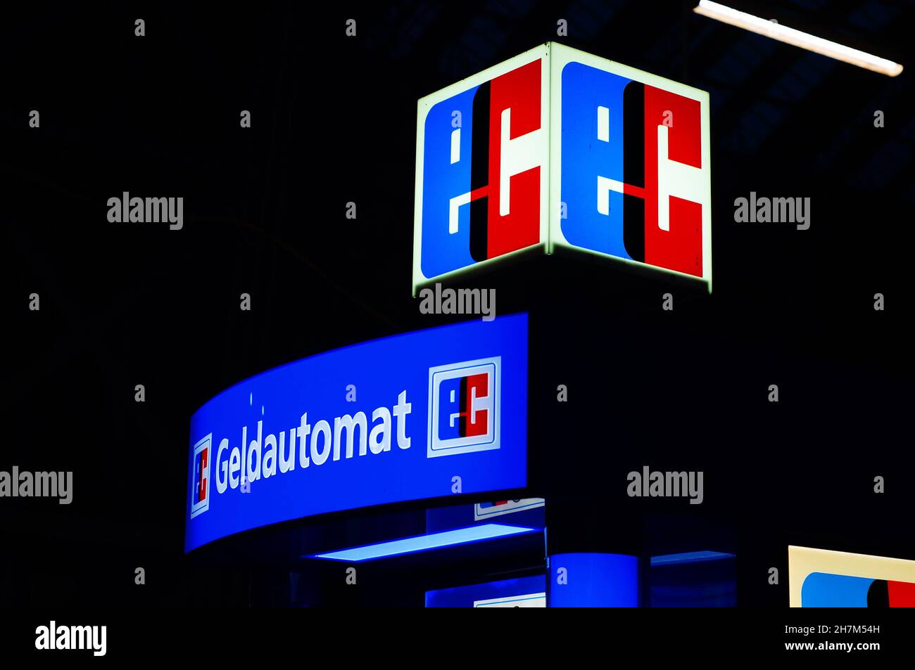 FRANKFURT, GERMANY - Nov 06, 2021: Illuminated display of an ATM at Frankfurt Central Station. Eurocheque-symbol. Stock Photo