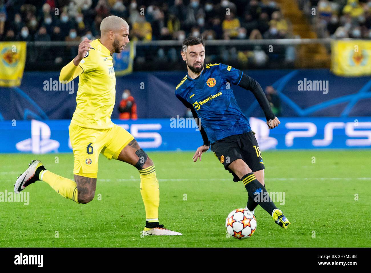 Villarreal, Spain. 23rd Nov, 2021. Etienne Capoue of Villarreal CF and Bruno Miguel Borges Fernandes of Manchester United FC in action during the UEFA Champions League group F, football match between Villarreal CF and Manchester United FC at Estadio de la Ceramica.(Final score; Villarreal CF 0:2 Manchester United FC) Credit: SOPA Images Limited/Alamy Live News Stock Photo