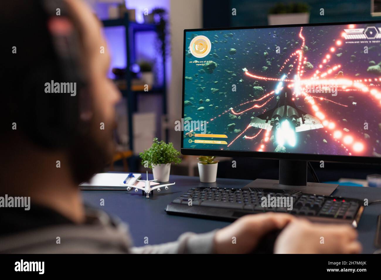 Free Photo  Player winning video games with controller and headset in  front of monitor. man using joystick and headphones, playing online games  on computer. person celebrating game win for leisure.