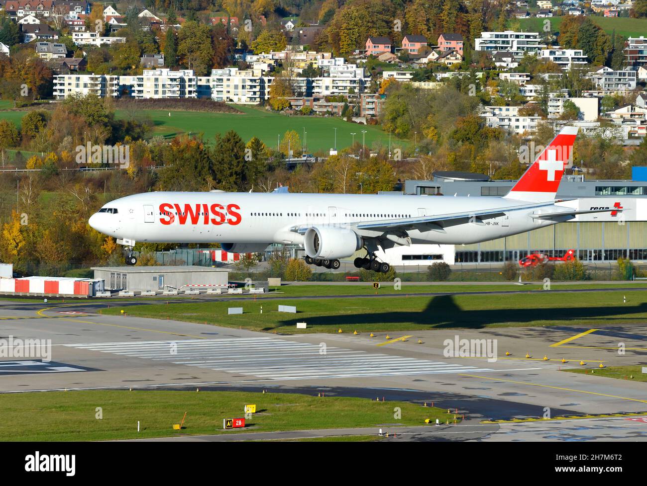 Swiss Boeing 777 landing at Zurich Airport. Airplane 777300ER of Swiss