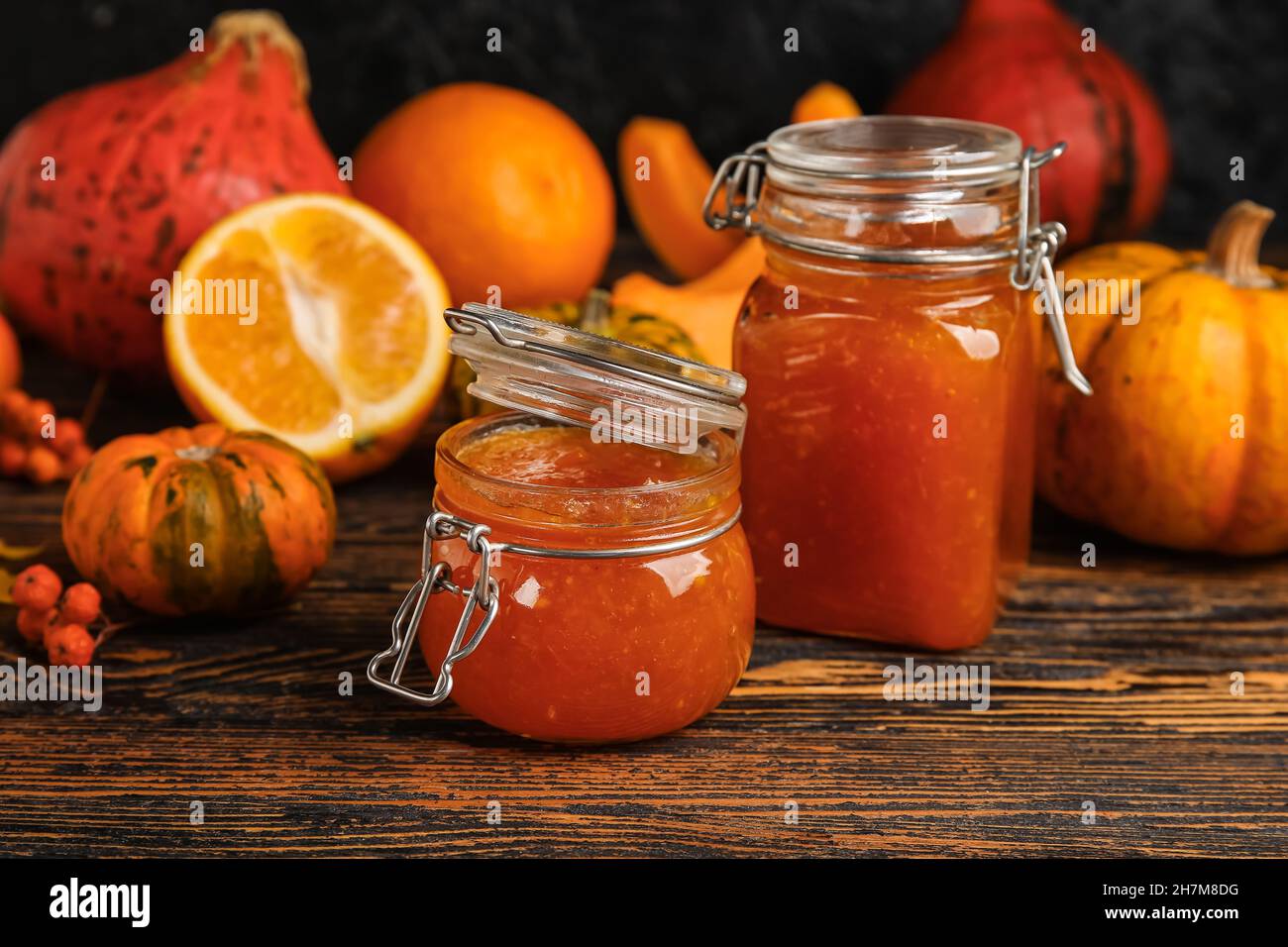 Jars of sweet pumpkin jam on table Stock Photohttps. person. www.alamy.com/...