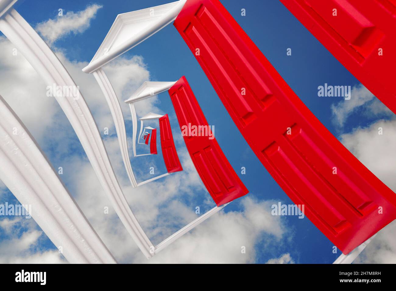 Infinity, dreaming and mysterious esoteric dreamy experience concept with surreal droste effect on a door isolated on cloudy blue sky background Stock Photo