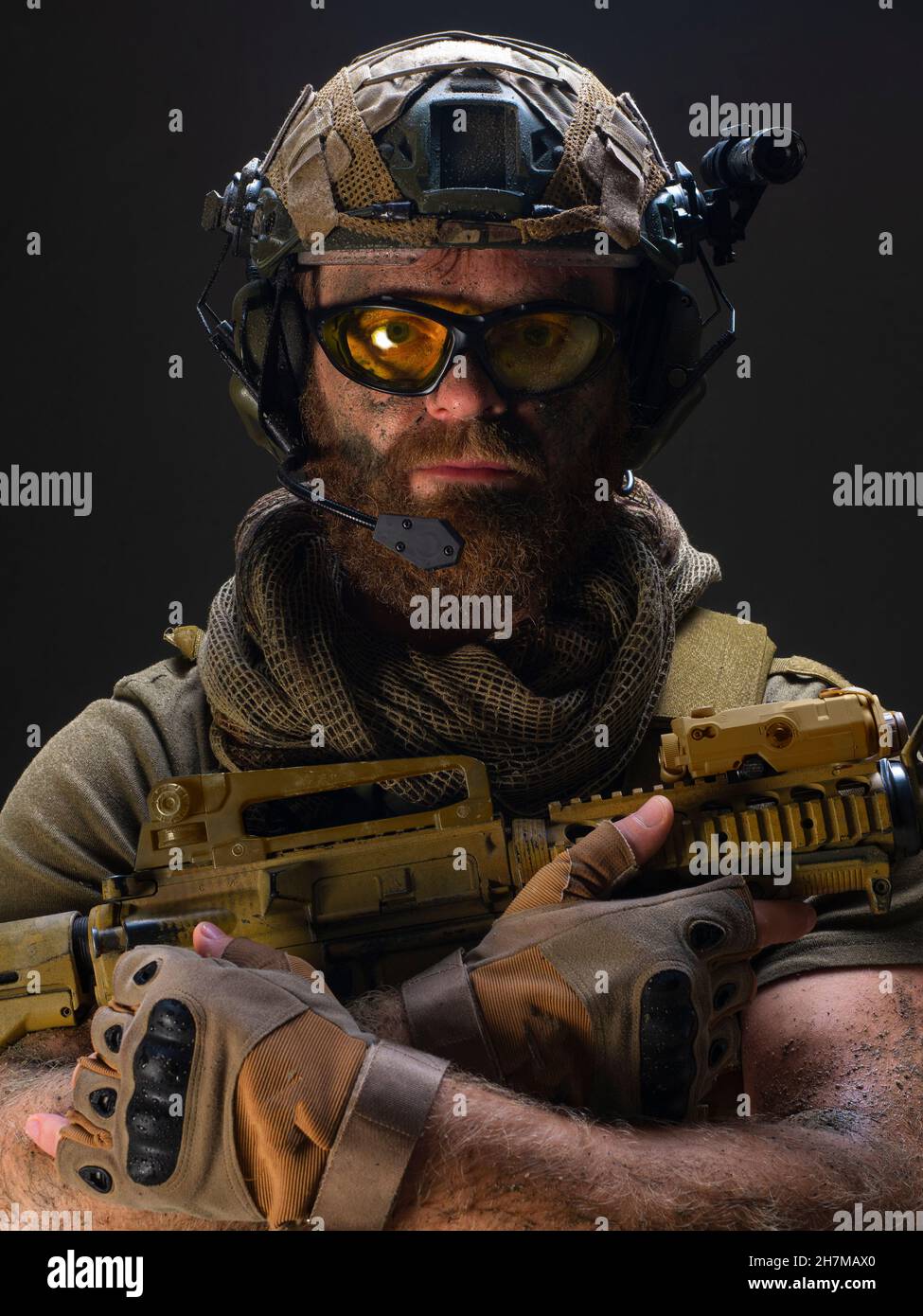 Portrait of an American soldier against the dark concrete background ...
