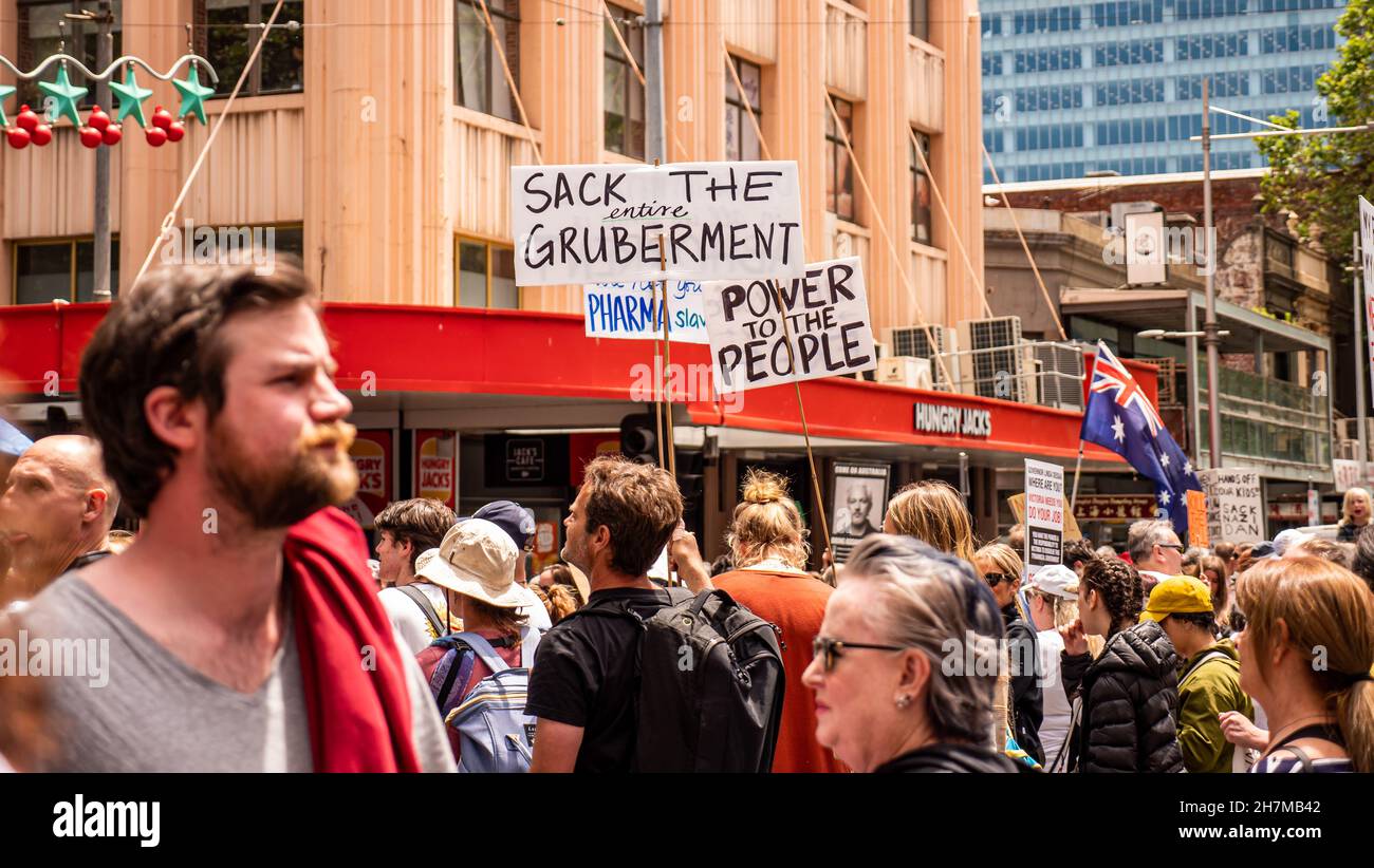Melbourne, Victoria Australia - November 20 2021: Protest signs being held up saying Sack the Entire Government and Power to the People, on Bourke Str Stock Photo