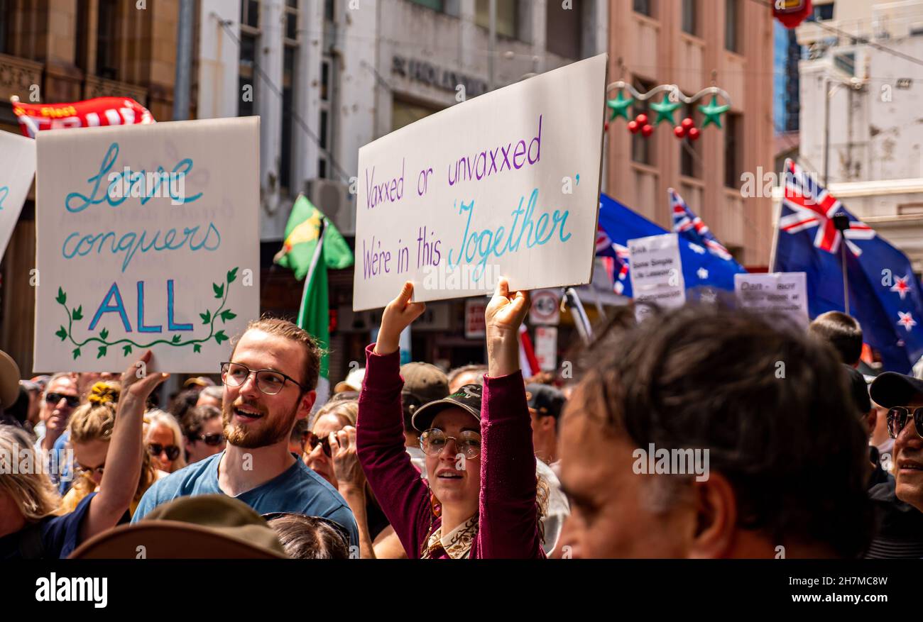 Melbourne, Victoria Australia - November 20 2021: People hold up peaceful anti-government signs, on Bourke Street at Freedom March and Kill the Bill P Stock Photo