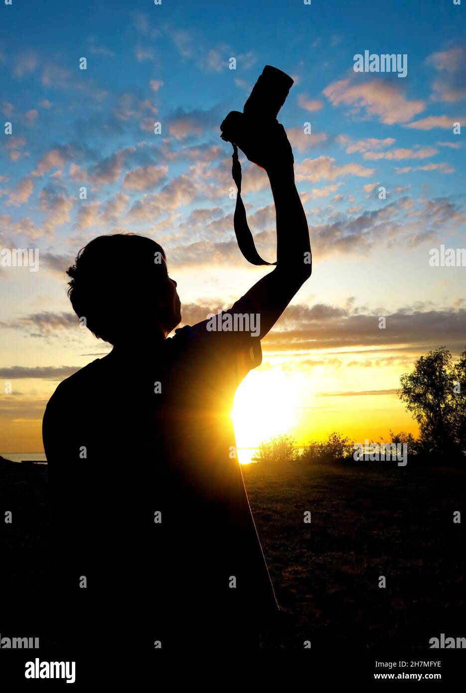 Happy Man Silhouette with Photo Camera on the Sunset Background Stock ...
