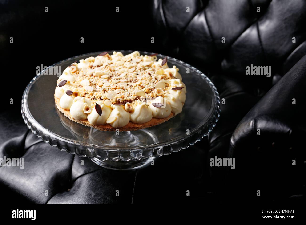 Shortcrust pastry with apples, meringue and nuts. Sweet dessert. A tasty dish.Culinary photography. Suggestion to serve the dish. Stock Photo