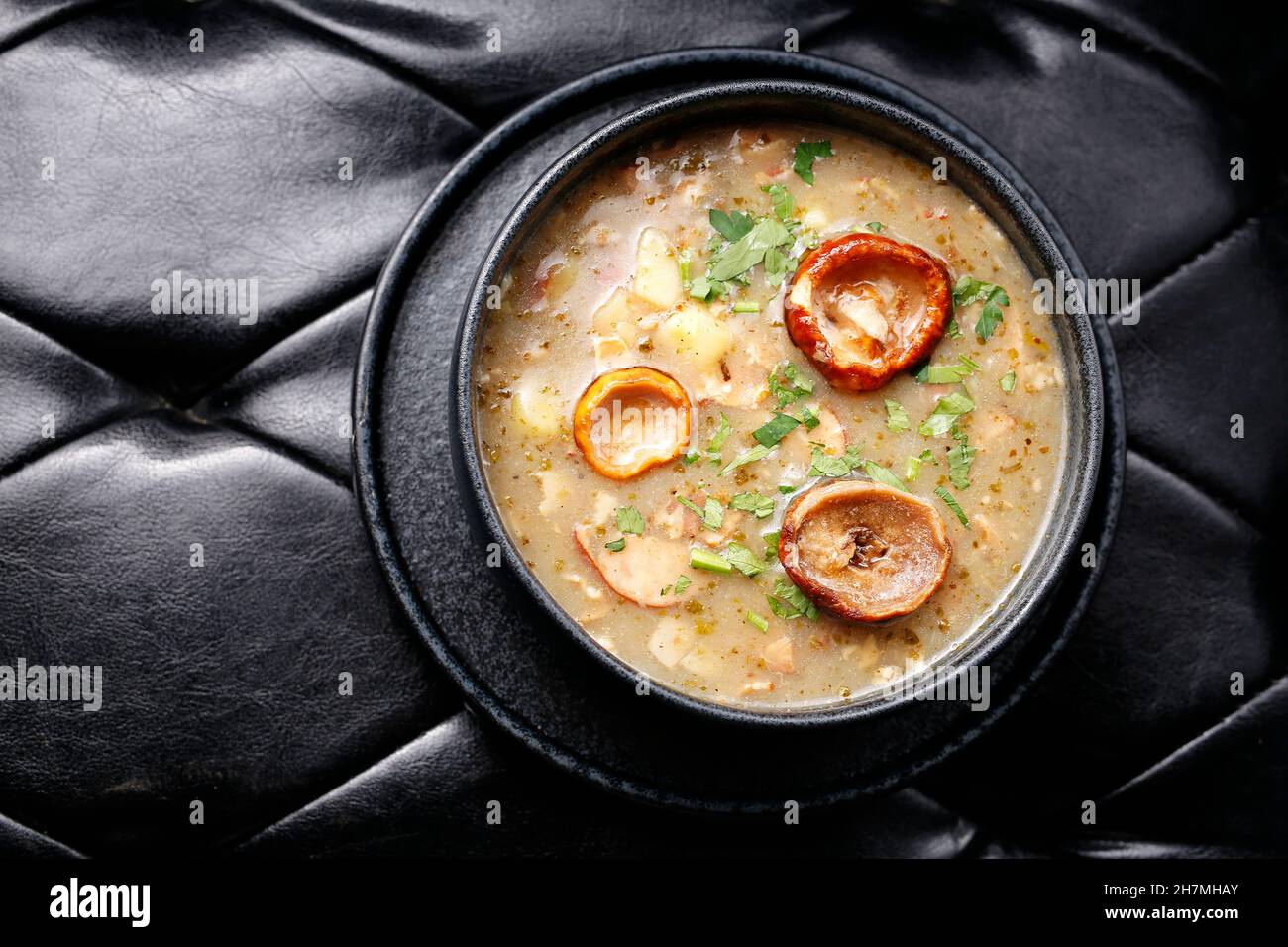 Mushroom soup. A tasty dish.Culinary photography. Suggestion to serve the dish. Takeaway, diet box. Appetizing ready-to-go dish served in a disposable Stock Photo