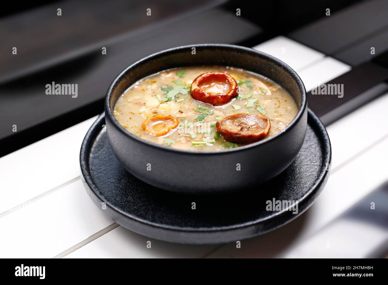 Mushroom soup. A tasty dish.Culinary photography. Suggestion to serve the dish. Takeaway, diet box. Appetizing ready-to-go dish served in a disposable Stock Photo