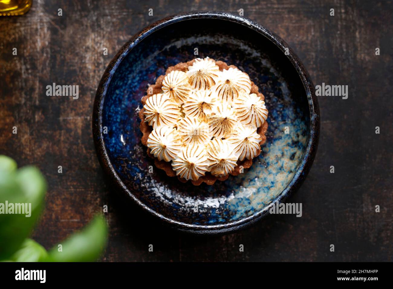 Shortcrust pastry with apples, meringue and nuts. Sweet dessert. A tasty dish.Culinary photography. Suggestion to serve the dish. Stock Photo