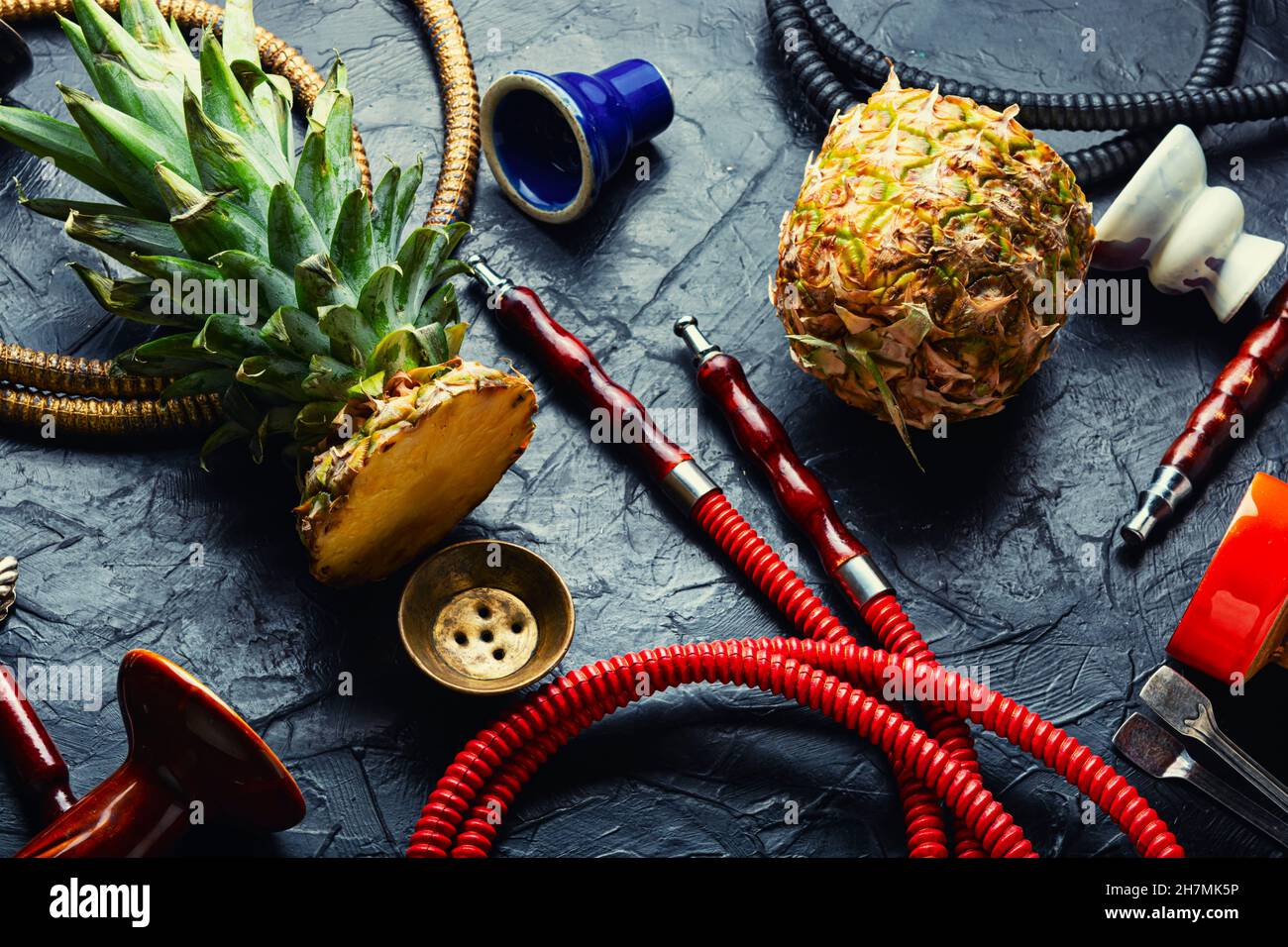 Smoking hookah with pineapple flavored tobacco. Modern hookah for