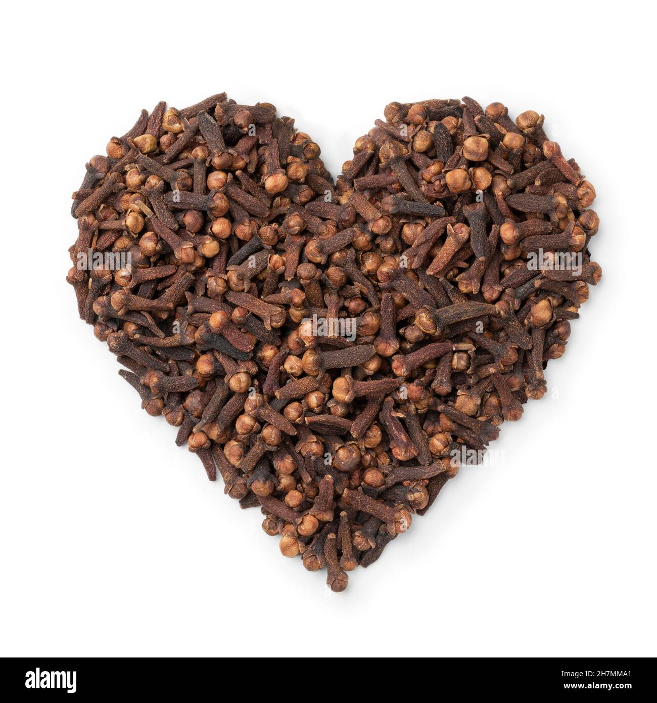 Dried cloves in heart shape isolated on white background Stock Photo