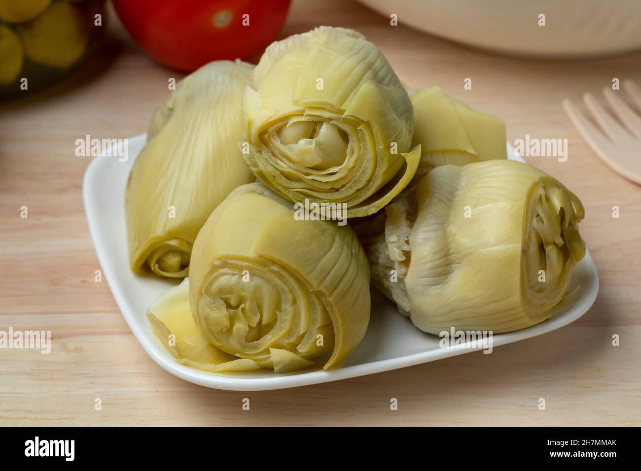 Plate with marinated artichoke hearts close up Stock Photo