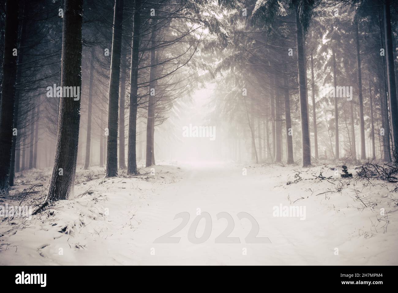 Snowy Winter Road with inprinted year 2022 Stock Photo Alamy