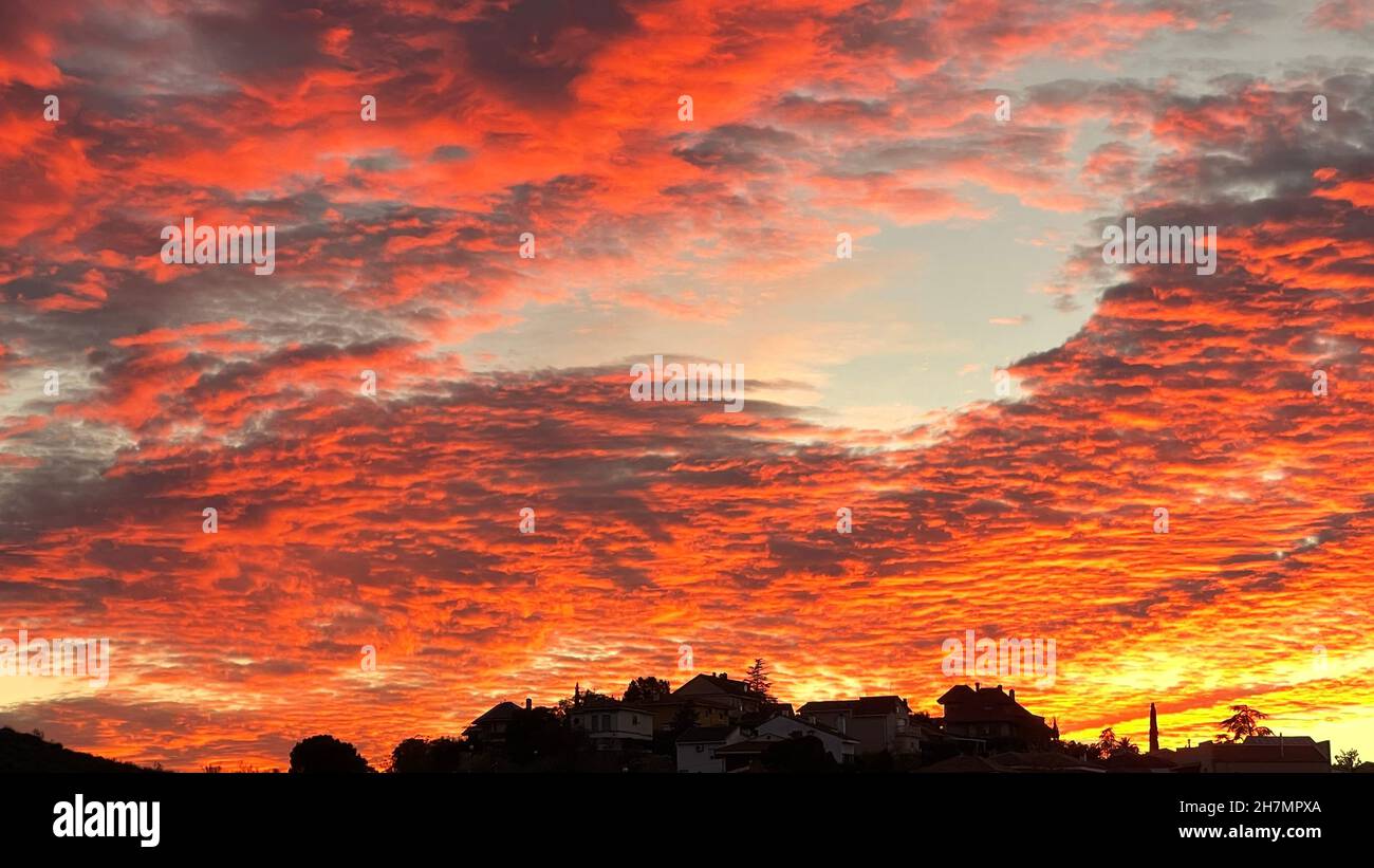 sunset in the sky with red clouds Stock Photo - Alamy