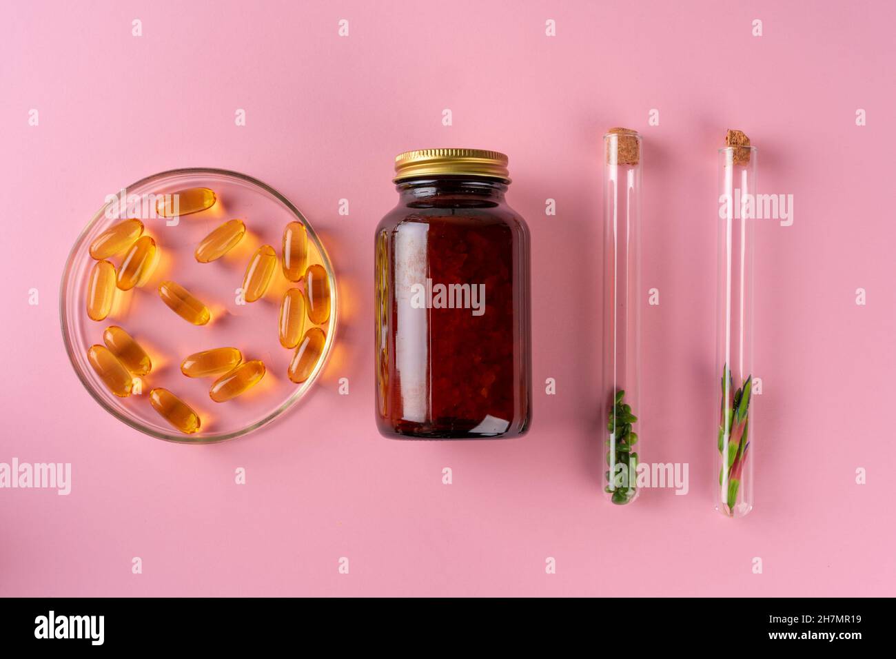 Herbs and Herbal dietary supplements top view on pink background Stock ...