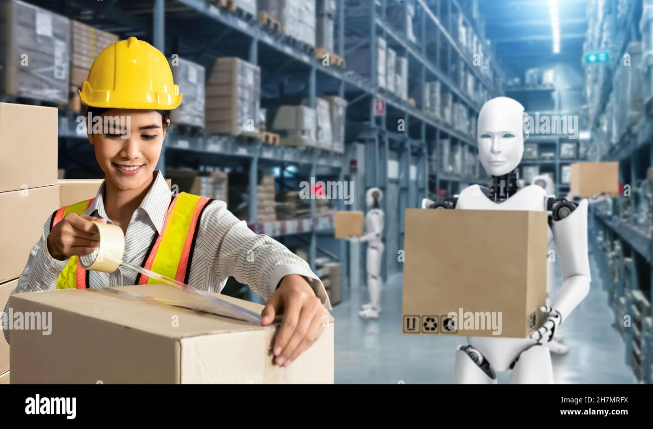 Logistics team working in an automated warehouse hi-res stock ...