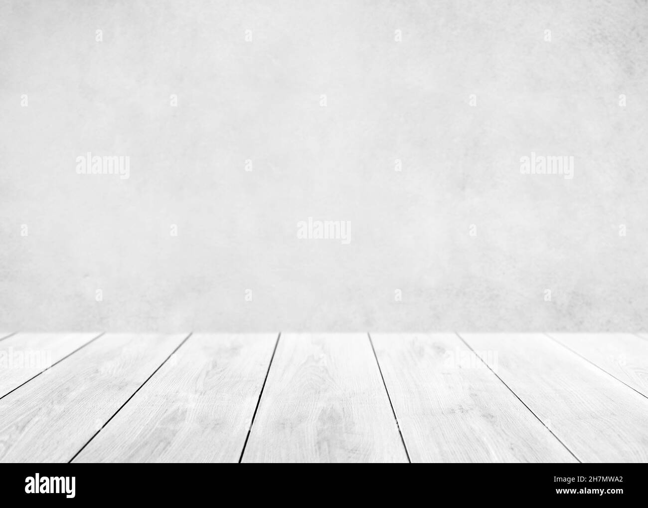 Empty white wood table top and blur wall. Wall Texture Background. Building banner mock up abstract background - can used for display or montage your Stock Photo