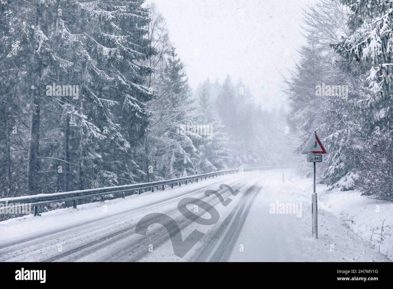 Snowy Winter Road with minted year 2022 Stock Photo Alamy
