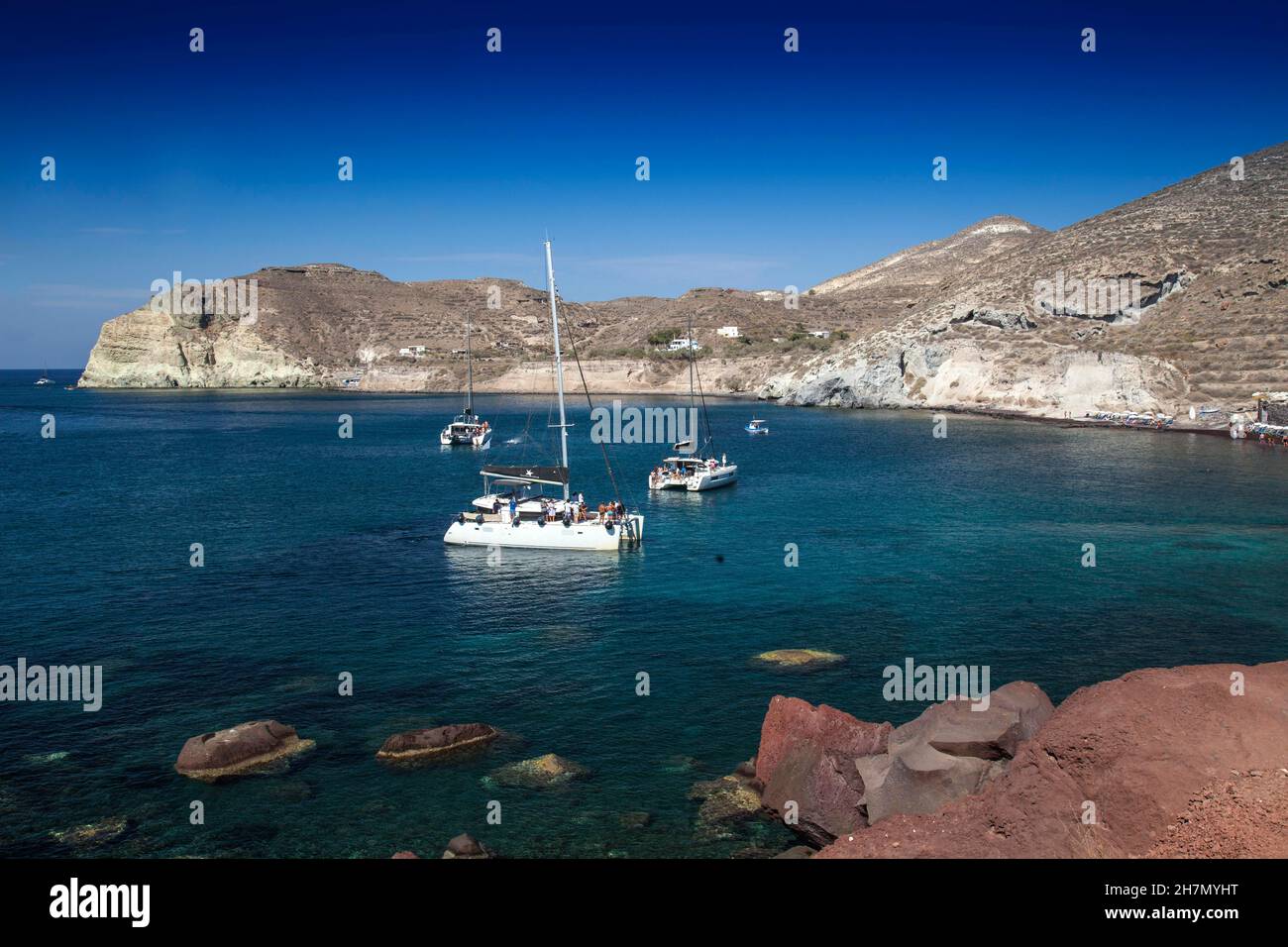 Catamaran moored in front of Red Beach, Kokkini Ammos near Akrotiri, Santorini, Cyclades, Greek Islands, Greece Stock Photo