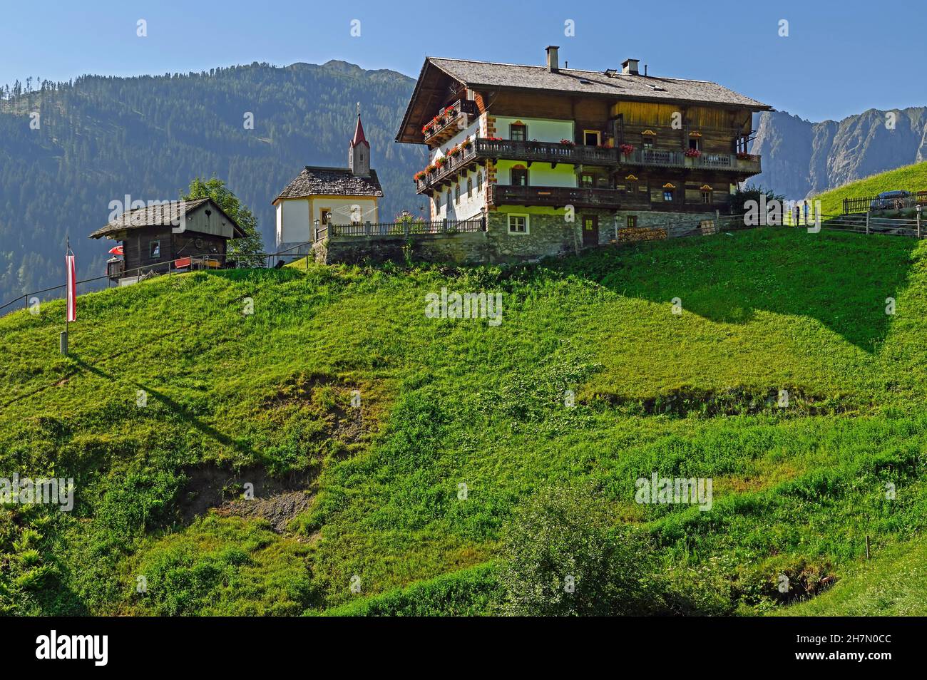 Farm in Lesachtal with small chapel, Liesing, midsummer atmosphere, Carinthia, Austria Stock Photo