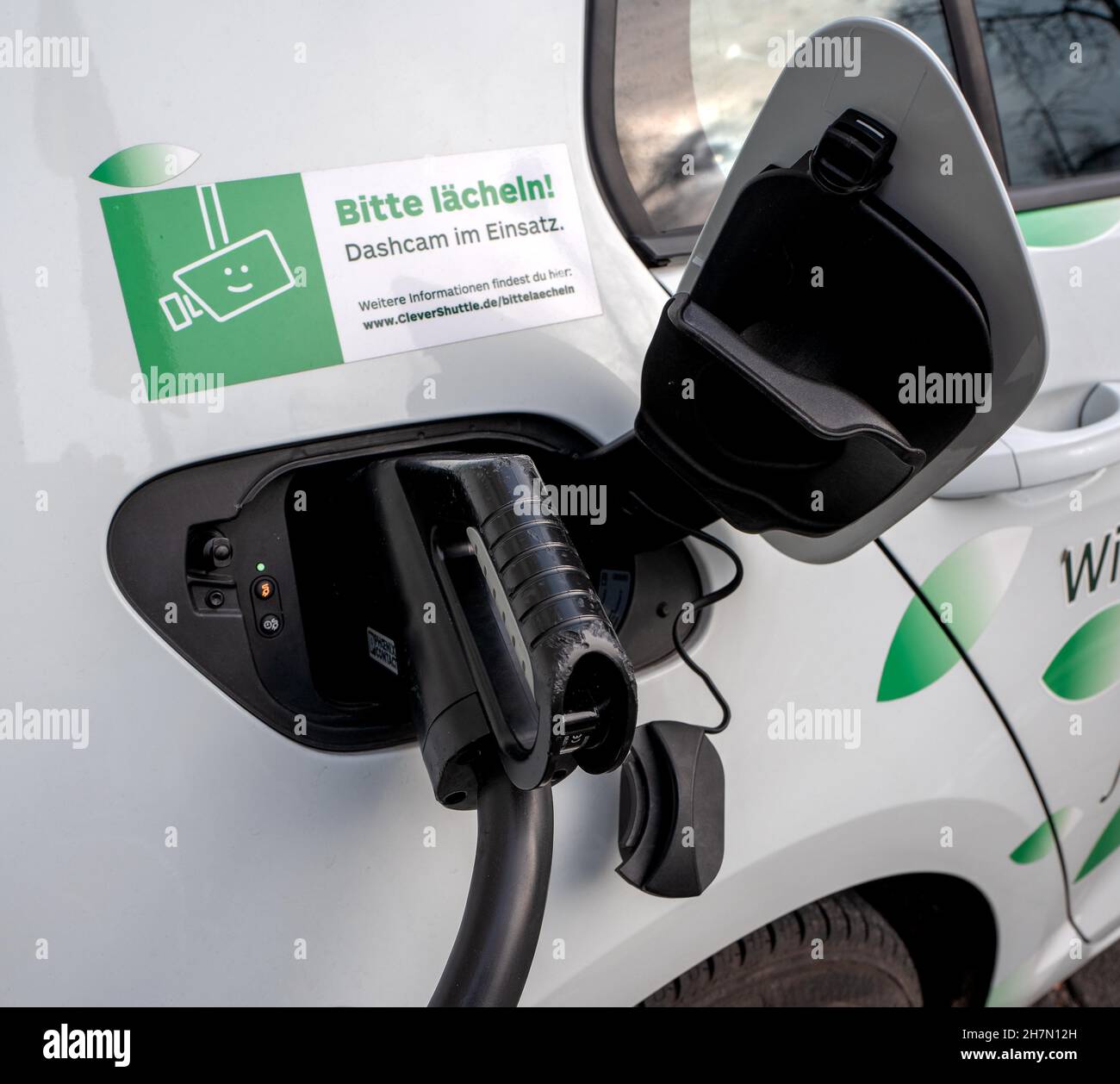 Vehicle charging electricity at the charging station for electric cars