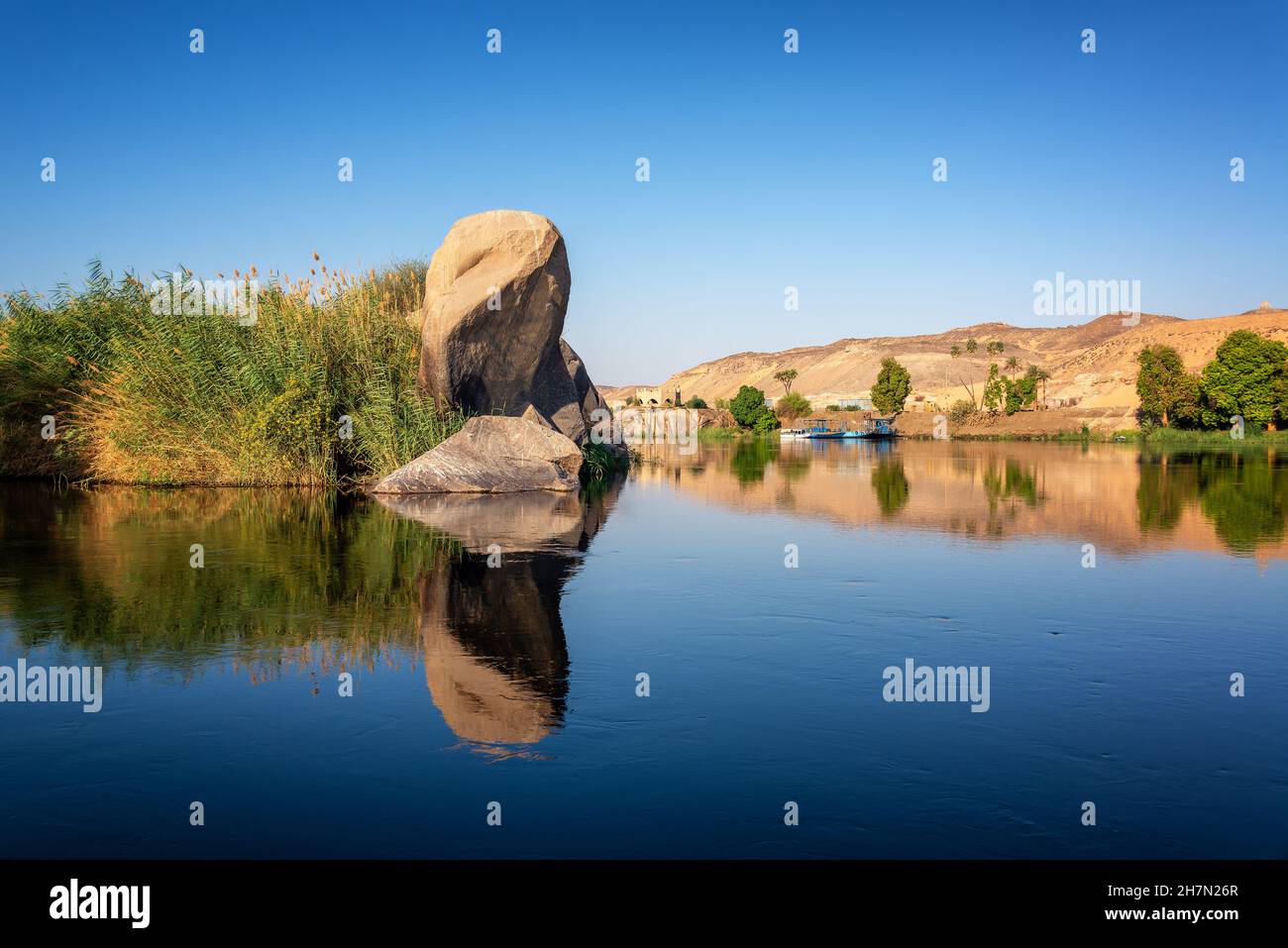 Mirror like reflections on the Nile River in Aswan, Egypt Stock Photo