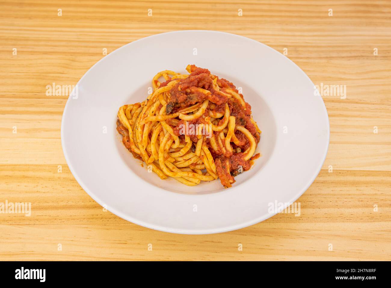 Bucatini all'amatriciana, is a traditional Italian pasta dish made with