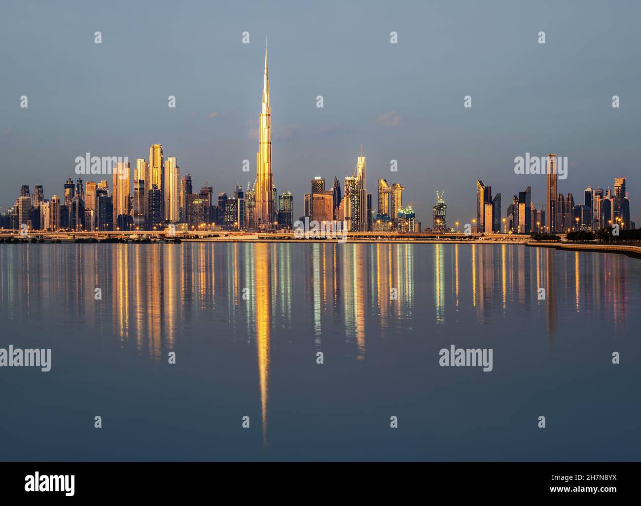 Skyline of Dubai at sunrise Stock Photo - Alamy