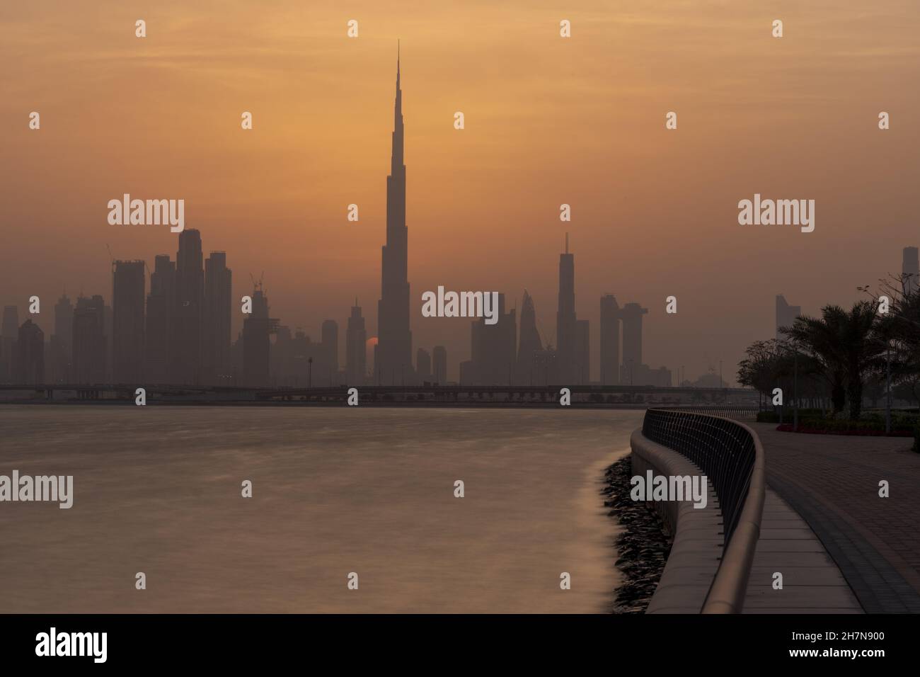 Skyline of Dubai at sunrise Stock Photo - Alamy