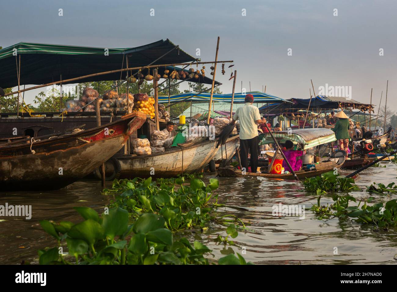 Soc Trang, Vietnam - April 5, 2018: People buying and selling agricultural products in a floating market on Mekong Riiver. Stock Photo