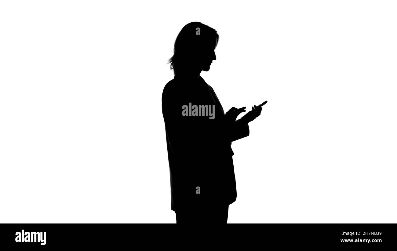 Photo of woman's silhouette with smartphone on isolated white ...