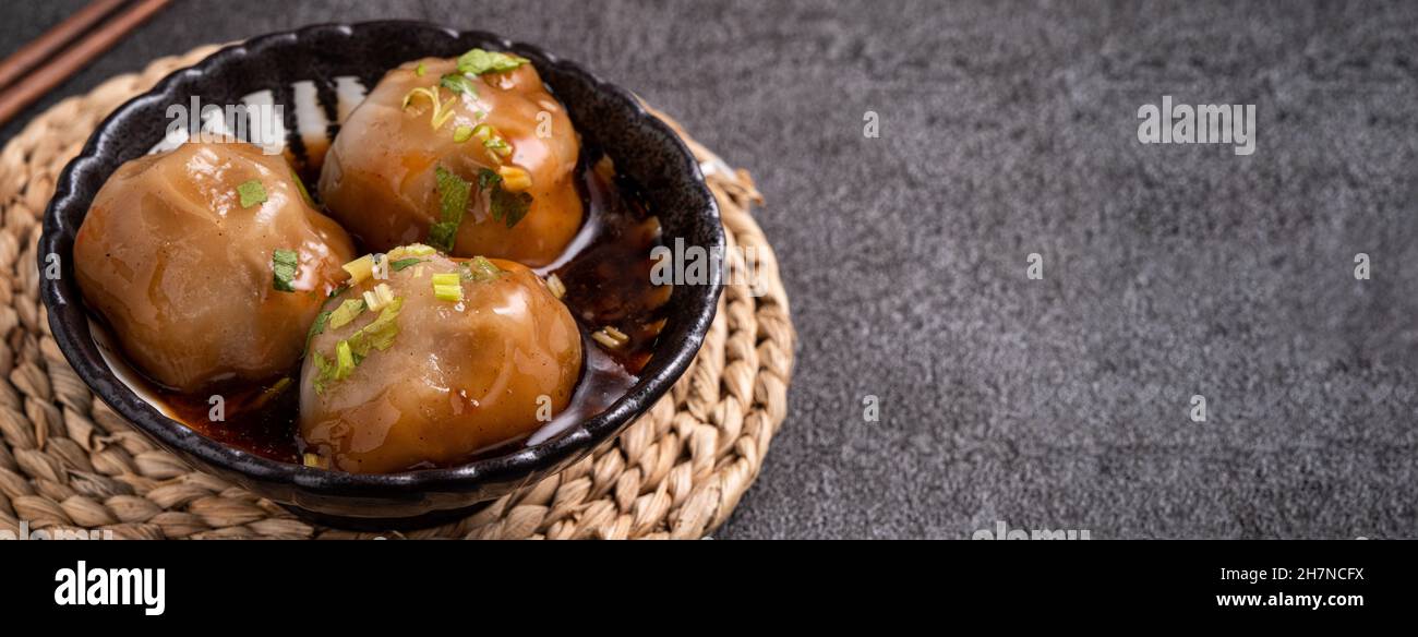 Close up of Bawan (Ba wan), Taiwanese meatball delicacy, delicious street food, steamed starch wrapped round shaped dumpling with pork and shrimp insi Stock Photo