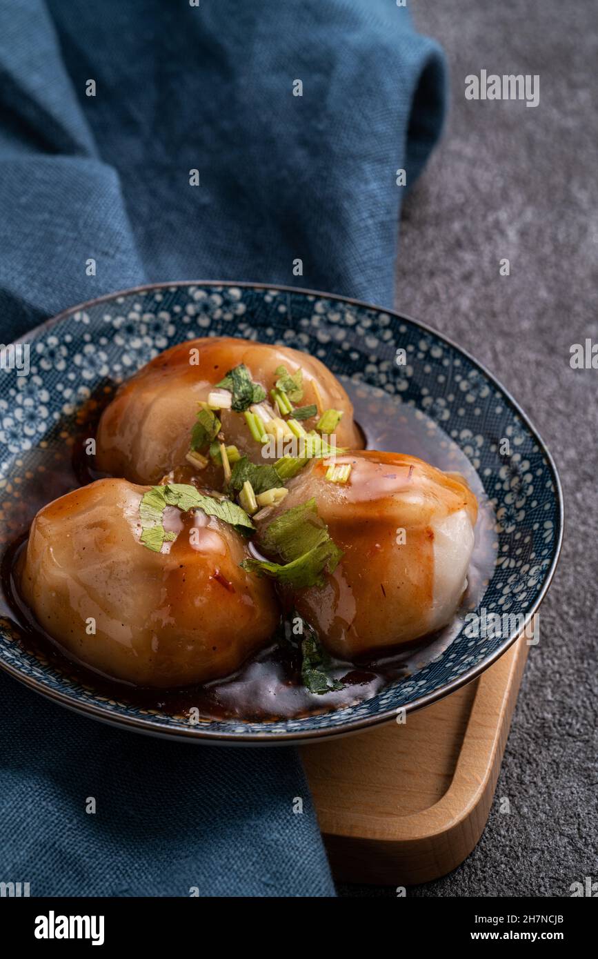 Close up of Bawan (Ba wan), Taiwanese meatball delicacy, delicious street food, steamed starch wrapped round shaped dumpling with pork and shrimp insi Stock Photo