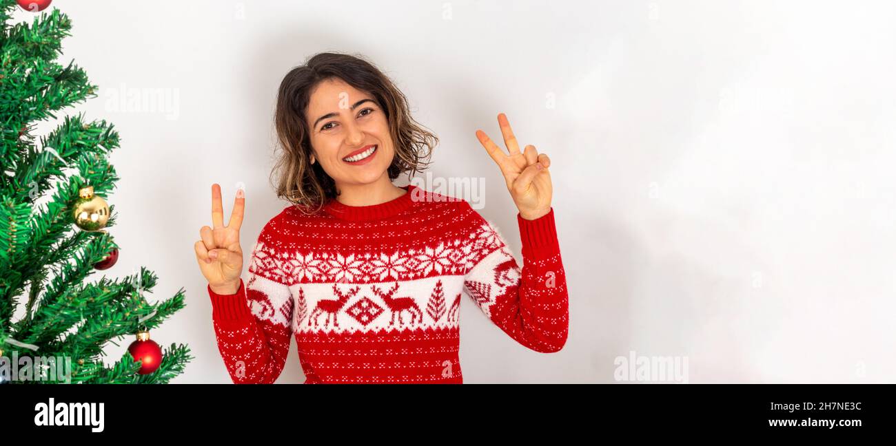Young adult woman celebrating new year eve and christmas at home. Stock Photo