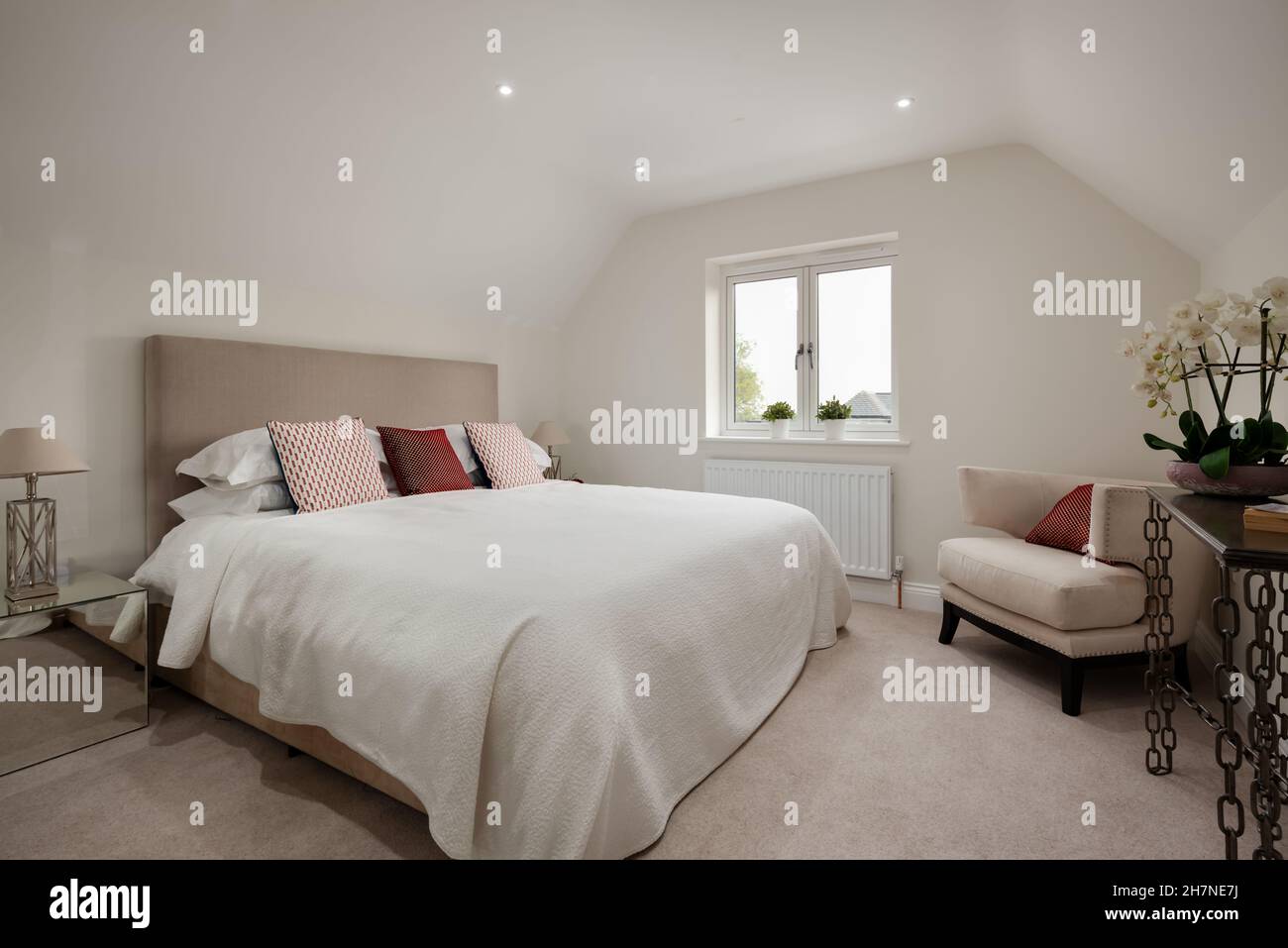 Dry Drayton, Cambridgeshire - October 31 2019: Home marketing staging in new house bedroom fully dressed as example arrangement of furnishing Stock Photo